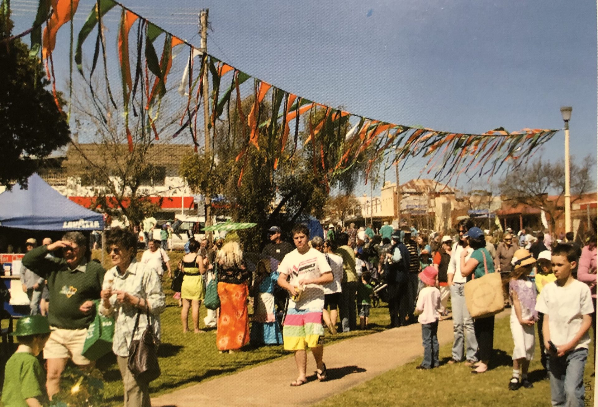 Crowd and stallholders at Turning Wave markets